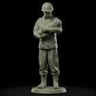 Matte OD green resin 100mm figurine of a featureless soldier in an M1943 field jacket in a fatherly pose."