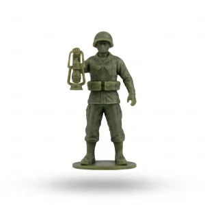 A green resin figurine of a WWII-style soldier wearing an M1 helmet, webbing, and uniform, holding up a vintage lantern