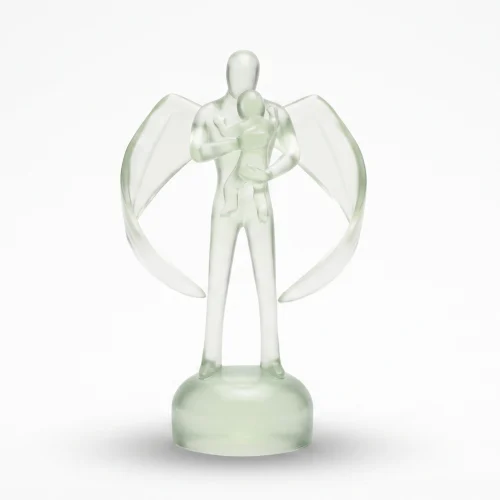 A flawless, clean translucent glass figurine of a winged guardian holding a child against a pure white background with a soft shadow